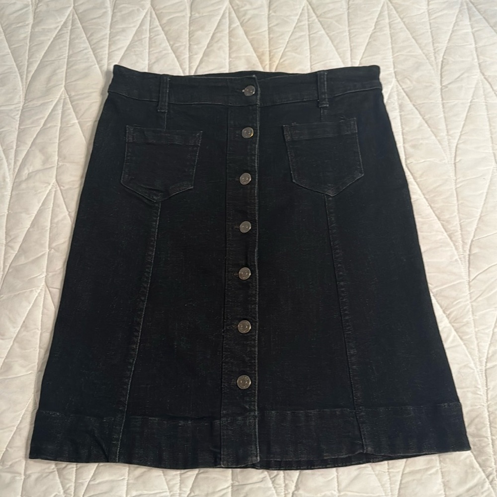 Black Denim Skirt. Buttons and 2 front pockets.